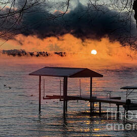 Sunrise Over a Misty Lake Dock by William Norton