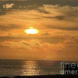 Sunrise Over Tranquil Ocean by Catherine Wilson