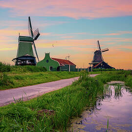 Sunset above farm houses and windmills of Zaanse Schans by Miroslav Liska