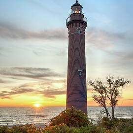 Sunset Behind the Point Little Sable Lighthouse by Michael Collins
