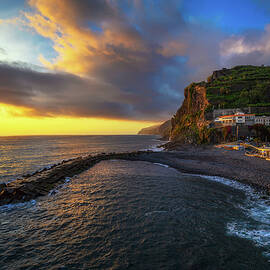 Sunset from the pier of Ponta do Sol in Madeira Island, Portugal by Miroslav Liska