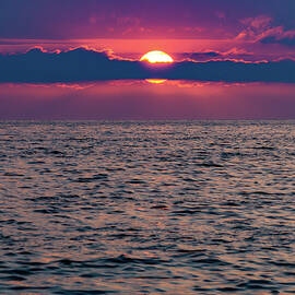 Sunset over Puerto Vallarta by Tommy Farnsworth