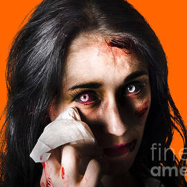Tearful woman with injuries by Jorgo Photography