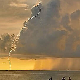 Thunderstorm over Beach at Sunset by Donn Ingemie