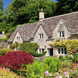 Traditional cottages and flower garden, Bibury, the Cotswolds, England by Neale And Judith Clark