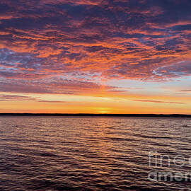 Vibrant Sunrise Over Tranquil Lake by William Norton