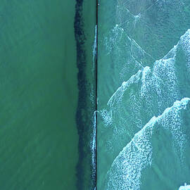 Waves by the Jetty wall by Oceanic SkyView
