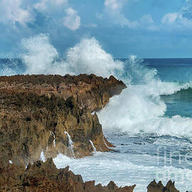 Waves Crashing on Rocky LoizaCliff by Beachtown Views