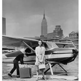 Woman by a Seaplane by John Rawlings