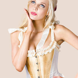 Woman in corset dress by Jorgo Photography