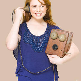 Woman Listening On A Vintage Wooden Box Telephone by Jorgo Photography