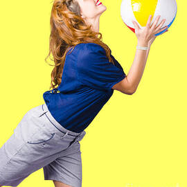 Woman Throwing Beach Ball On Summer Yellow Background by Jorgo Photography