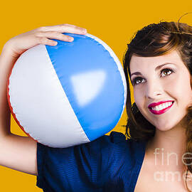 Woman with beach ball by Jorgo Photography