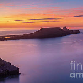 Worms Head Sunset, Rhossili, Gower coast, Wales by Neale And Judith Clark