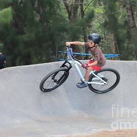Young Cyclist on Skate Ramp 2396 by Donn Ingemie