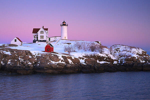 Wall Art featuring the photograph Nubble Light Under A Pastel Winter Sky by Jeff Sinon