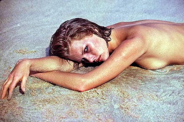 Brunette Wall Art featuring the photograph Patti Hansen Topless On A Beach #1 by Arthur Elgort