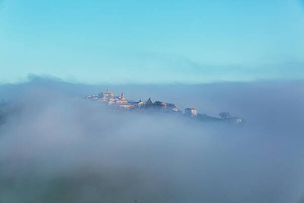 Wall Art featuring the photograph Small Italian Village In The Fog #1 by Deimagine