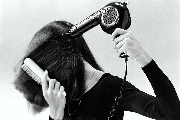 Monochrome Photograph - Model Blow Drying Hair #2 by Mike Reinhardt