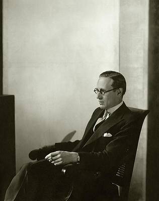Seated Gentleman in Suit and Glasses Photograph