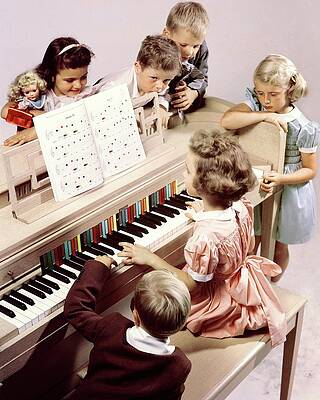 Wall Art featuring the photograph A Group Of Children At The Piano by Herbert Matter