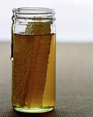 Bee Wall Art featuring the photograph A Jar Of Honey by Romulo Yanes