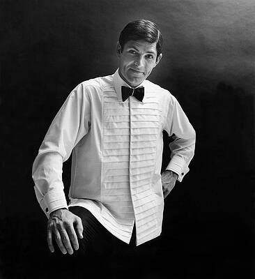 Wall Art featuring the photograph A Male Model In A Cross-pleated Shirt And Black by Leonard Nones