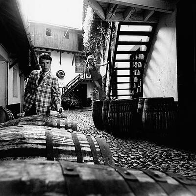 Cobbled Alley with Barrels and Figures Photograph