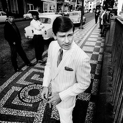 Man in Striped Suit on Mosaic Street Photograph