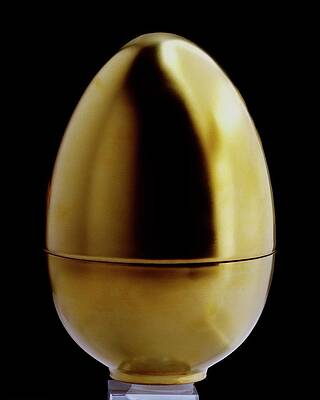 Golden Egg on Black Background Wall Art