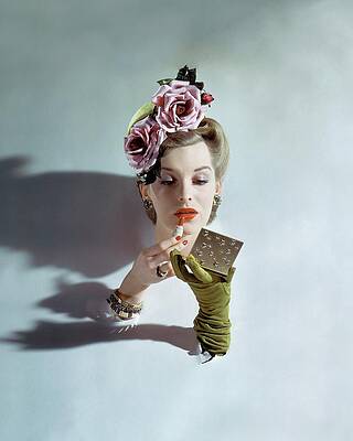 Elegant Woman Applying Lipstick Photograph