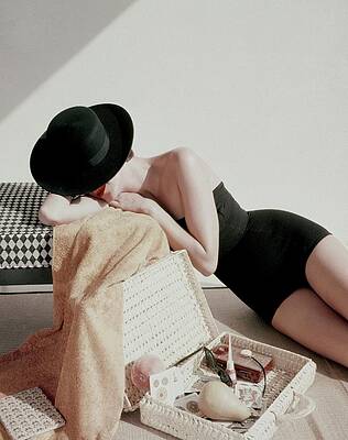 Woman Relaxing with Straw Hat Photograph
