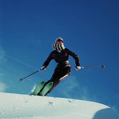 Skier in Motion on Sunny Day Wall Art