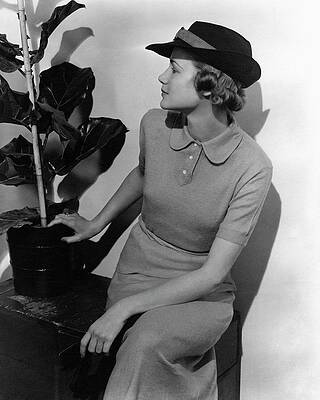 Wall Art featuring the photograph A Model Wearing A Knit Dress by Lusha Nelson