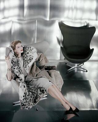 Elegant Woman in Modern Chair Wall Art