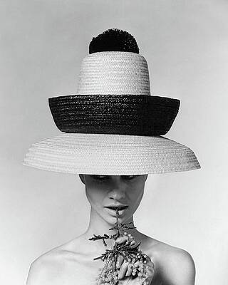 Elegant Woman in Layered Straw Hats Wall Art