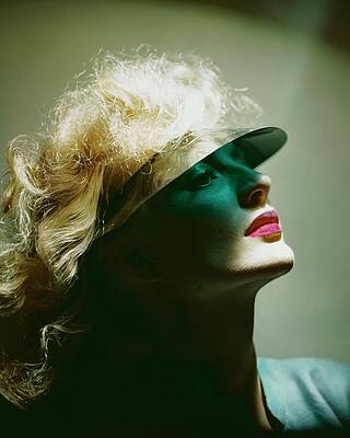 Shade Wall Art featuring the photograph A Model Wearing A Sun Shade by Erwin Blumenfeld