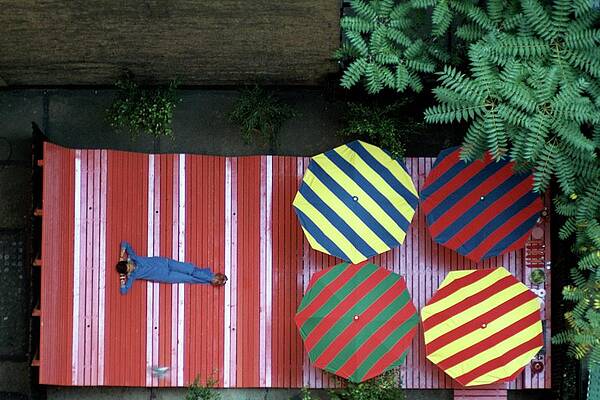 Colorful Patio with Striped Umbrellas Photograph