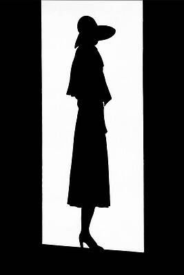 Silhouette of a Woman in a Hat Photograph