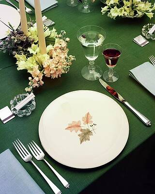 Fork Wall Art featuring the photograph A Table Setting On A Green Tablecloth by Haanel Cassidy