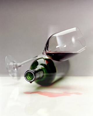 Toppled Wine Glass and Bottle Photograph