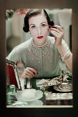 Wall Art featuring the photograph A Woman Applying Make-up by Frances Mclaughlin-Gill