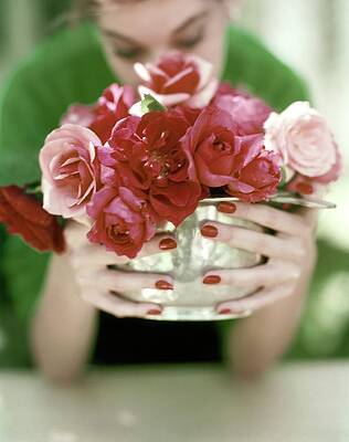 Woman Holding a Bouquet of Roses Photograph