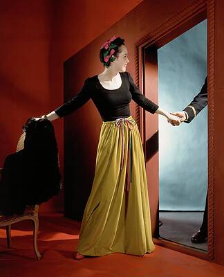 Vibrant Photograph - A Woman Holding The Hand Of A Man By A Doorway by Horst P. Horst