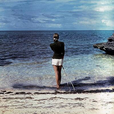 Contemplative Moment by the Sea Wall Art