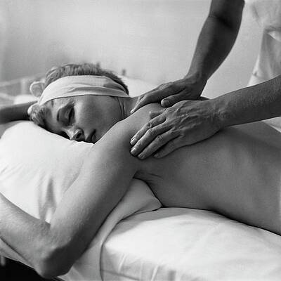 Spa Wall Art featuring the photograph A Woman Receiving A Massage by Frances Mclaughlin-Gill