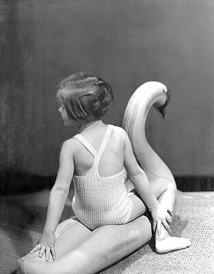 6 Wall Art featuring the photograph A Young Girl Sitting On A Toy Swan by Horst P. Horst
