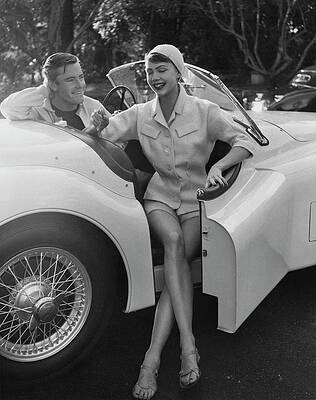 Car Photograph - A Young Model Sitting In A Convertible Sports Car by Karen Radkai