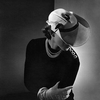 Elegant Woman with Wide-Brimmed Hat Photograph