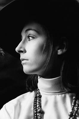 Wall Art featuring the photograph Anjelica Huston Wearing Beads by Arnaud de Rosnay